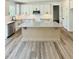 Open kitchen featuring white cabinets, stainless appliances, granite counters, and center island at 40 Sunrise Ct, Spring Hope, NC 27882