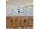 Kitchen island with wood cabinets, granite counters, and views of the living room at 40 Sunrise Ct, Spring Hope, NC 27882