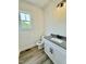 Bathroom features granite counters, modern vanity, and luxury vinyl plank flooring at 40 Sunrise Ct, Spring Hope, NC 27882