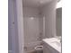 Full bathroom with tub and shower combination, white vanity, and neutral paint color at 73 High Hampton Way, Fuquay Varina, NC 27526