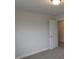 Bedroom with carpet and neutral paint color. Door leads to other parts of home at 73 High Hampton Way, Fuquay Varina, NC 27526