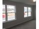 Bedroom with carpet, neutral paint color, and windows providing natural light at 73 High Hampton Way, Fuquay Varina, NC 27526