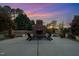 Cozy outdoor fireplace with seating area, perfect for evening gatherings and sunset views at 166 Weldon Dr, Clayton, NC 27520