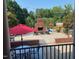 A backyard with an outdoor fireplace and patio area for lounging and outdoor entertainment at 166 Weldon Dr, Clayton, NC 27520