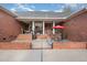 An outdoor patio area with a red brick facade and ample space for entertaining at 166 Weldon Dr, Clayton, NC 27520