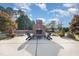 A backyard with an outdoor fireplace and patio area, perfect for relaxation and entertainment at 166 Weldon Dr, Clayton, NC 27520