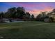 Expansive backyard with pool, storage shed, and ample green space at 166 Weldon Dr, Clayton, NC 27520