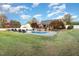 The spacious backyard features a large pool, lounge chairs, and a patio perfect for gatherings at 166 Weldon Dr, Clayton, NC 27520