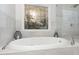 Luxurious bathroom showcasing a soaking tub and a glass-enclosed shower at 166 Weldon Dr, Clayton, NC 27520