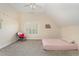 Bedroom with plush carpeting, window, and simple decor at 166 Weldon Dr, Clayton, NC 27520