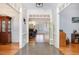 Grand foyer with elegant moldings and hardwood floors, offering a view into the living area at 166 Weldon Dr, Clayton, NC 27520