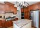 Gourmet kitchen boasts stainless steel appliances, custom cabinetry and granite countertops at 166 Weldon Dr, Clayton, NC 27520