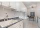 Well-appointed laundry room features ample storage space and modern appliances at 166 Weldon Dr, Clayton, NC 27520