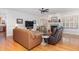 Cozy living room with a fireplace, comfortable seating, and abundant natural light at 166 Weldon Dr, Clayton, NC 27520