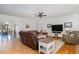 Spacious living room featuring wood floors, comfortable seating, and ample natural light at 166 Weldon Dr, Clayton, NC 27520