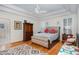 Comfortable bedroom with a decorative ceiling and hardwood floors at 166 Weldon Dr, Clayton, NC 27520
