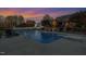 Sparkling pool with diving board, surrounded by lounge chairs and lush landscaping at 166 Weldon Dr, Clayton, NC 27520