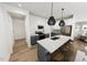 Modern kitchen with island, stainless steel appliances, and shaker cabinets at 3929 Willow Gate Way, Raleigh, NC 27604