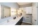 Modern bathroom featuring double sinks, sleek cabinetry, and updated fixtures at 1414 Whippoorwill Ln, Chapel Hill, NC 27517