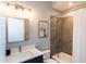 Bathroom with vanity, mirror, toilet, and tub with shower at 1414 Whippoorwill Ln, Chapel Hill, NC 27517