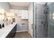 Bright bathroom featuring a glass shower, double sink vanity, and modern finishes and fixtures at 1414 Whippoorwill Ln, Chapel Hill, NC 27517