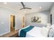 Well-lit bedroom featuring hardwood floors, ensuite bathroom and walk-in closet at 1414 Whippoorwill Ln, Chapel Hill, NC 27517
