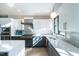 Bright kitchen with stainless steel appliances, modern backsplash, and a large island at 1414 Whippoorwill Ln, Chapel Hill, NC 27517