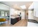 Modern kitchen with stainless steel appliances, quartz countertops, and ample cabinet space at 1414 Whippoorwill Ln, Chapel Hill, NC 27517