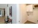 Bright laundry area featuring cabinetry for convenient storage and organization at 1414 Whippoorwill Ln, Chapel Hill, NC 27517