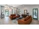Inviting living room with stylish furnishings, large windows, and a modern decor at 1414 Whippoorwill Ln, Chapel Hill, NC 27517