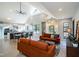 Open-concept living space with a modern kitchen, bright seating area, and skylight at 1414 Whippoorwill Ln, Chapel Hill, NC 27517