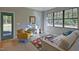 Cozy living room with a comfortable couch, modern decor, and view to the backyard at 1414 Whippoorwill Ln, Chapel Hill, NC 27517