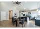 Open-concept living space with modern kitchen, dining table, and high ceilings with plenty of natural light at 1414 Whippoorwill Ln, Chapel Hill, NC 27517