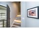 Staircase with wood stairs and custom lighting at 1414 Whippoorwill Ln, Chapel Hill, NC 27517