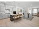 Modern kitchen with gray cabinets, large island, stainless steel appliances, and wood flooring at 520 Gainer Dr # 6, Raleigh, NC 27610