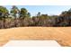 Unfinished lot with a concrete patio, waiting for a new home at 70 Little Creek Dr, Lillington, NC 27546