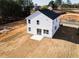 New two-story home with white siding and sliding glass doors in the backyard at 70 Little Creek Dr, Lillington, NC 27546