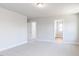Bedroom featuring two doorways, neutral walls and carpet, and a ceiling light at 70 Little Creek Dr, Lillington, NC 27546