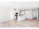 Open-concept kitchen with white cabinets, an island, and stainless steel appliances at 70 Little Creek Dr, Lillington, NC 27546
