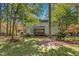 Beautiful backyard with a charming screened-in porch and a wooden deck, great for outdoor living at 413 Chadwick Ln, Efland, NC 27243
