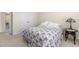 Comfortable bedroom with floral bedding and natural light from windows at 413 Chadwick Ln, Efland, NC 27243