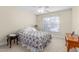 Cozy bedroom featuring a queen-sized bed, side tables and a window at 413 Chadwick Ln, Efland, NC 27243