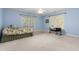 Light blue bedroom featuring a ceiling fan and a sewing table at 413 Chadwick Ln, Efland, NC 27243
