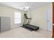 Exercise room includes a treadmill and a storage cabinet at 413 Chadwick Ln, Efland, NC 27243