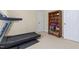 This exercise room has a NordicTrack treadmill and a bookshelf at 413 Chadwick Ln, Efland, NC 27243