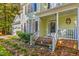 Charming home with a well-manicured lawn, two-car garage, and inviting front porch at 413 Chadwick Ln, Efland, NC 27243