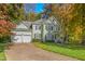 Beautiful traditional home with a two car garage and a well-manicured lawn at 413 Chadwick Ln, Efland, NC 27243