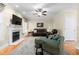 Spacious living room with a fireplace, plush seating, and open layout at 413 Chadwick Ln, Efland, NC 27243
