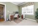 Well-lit home office featuring neutral-toned walls, a ceiling fan, natural light, and a dedicated workspace at 413 Chadwick Ln, Efland, NC 27243
