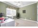 Bright home office featuring neutral-toned walls, a ceiling fan, natural light, and a dedicated workspace at 413 Chadwick Ln, Efland, NC 27243